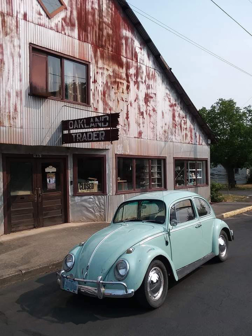 VW Type 1 in front of an old store