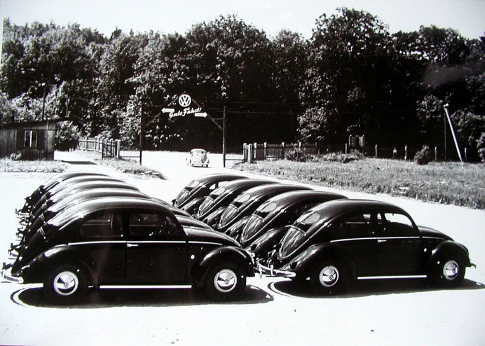 Ten black Split Window Beetles lined up at the import facilites of Porsche Konstruktion GesmbH in Salzburg