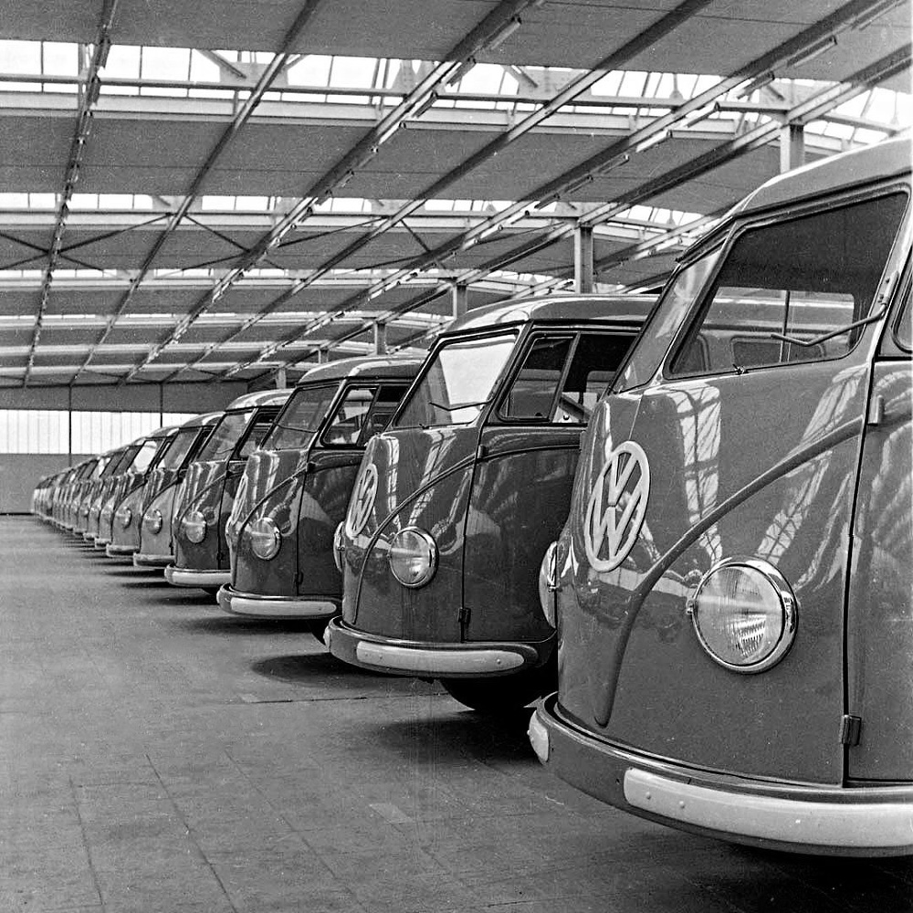 A line of new Type 2 'Barndoor' Transporters in a hall at Volkswagenwerk Wolfsburg in 1953