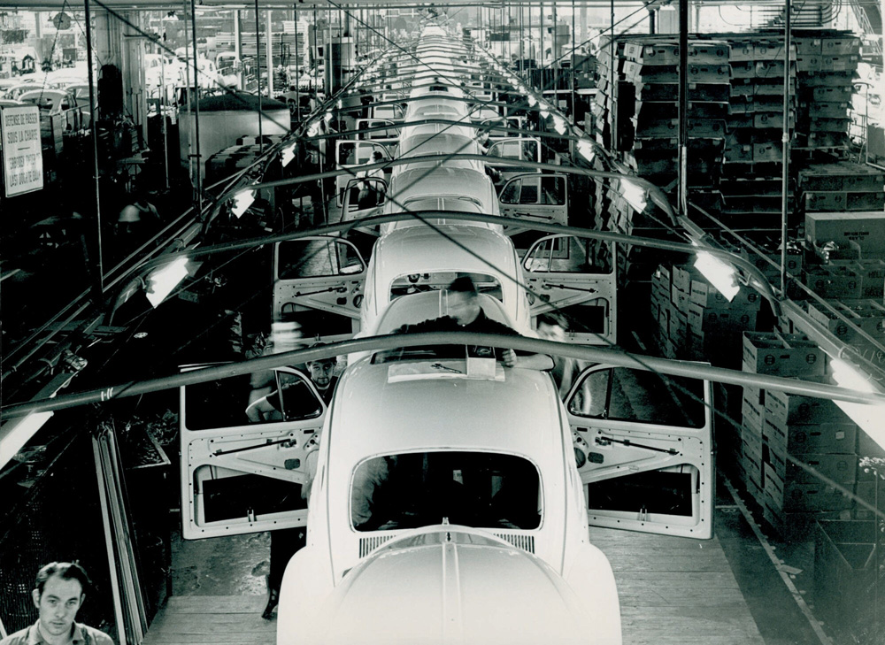 A man is working on the sunroof mechanism on this 1965 or 1966 Beetle at the D'Ieteren factory in Forest, Brussels, Belgium. This factory was closed down in February 2025, after 75 years of making cars.